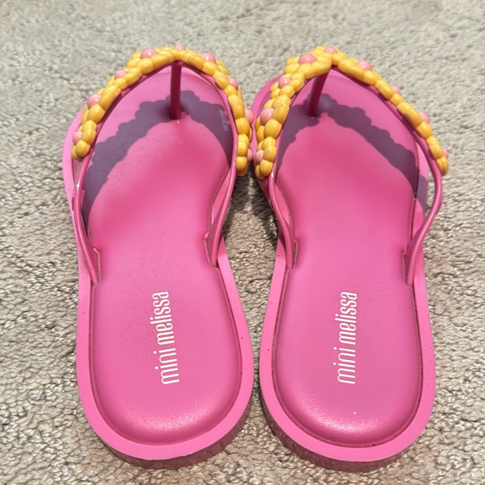 Many Melissa’s size 2 pink flip-flops with flowers